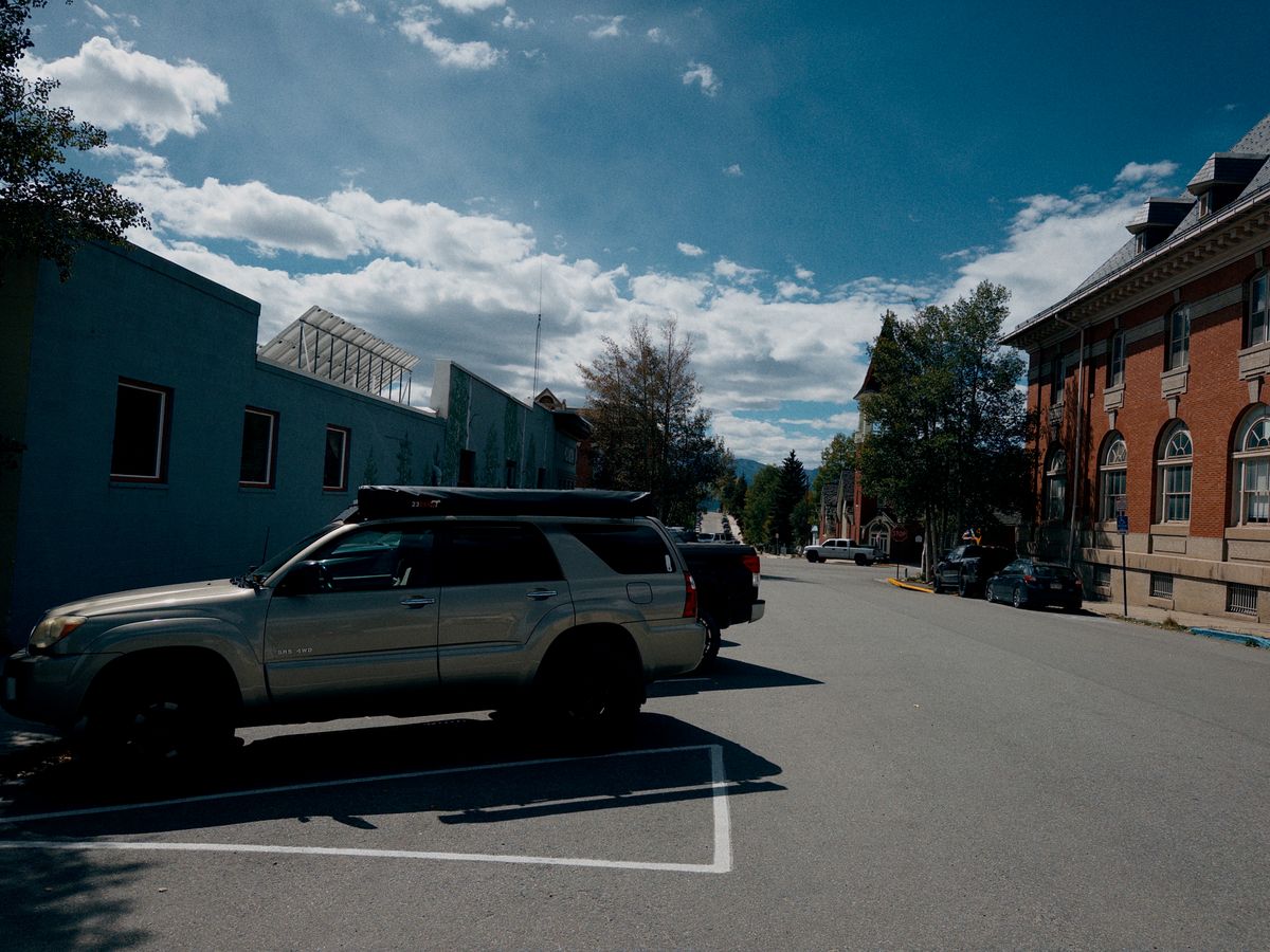 A parked SUV on a sunny street in downtown Leadville