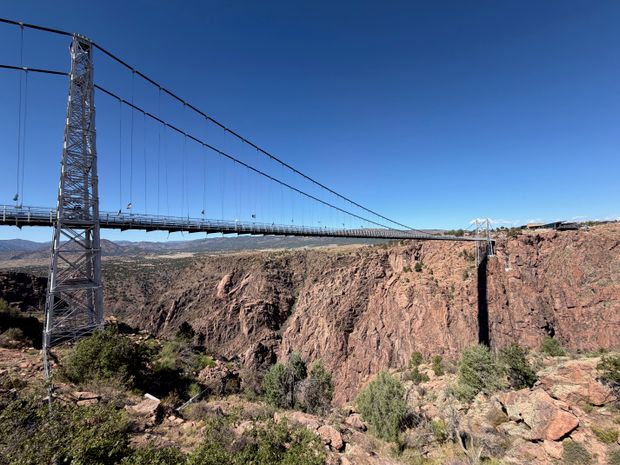 The Royal Gorge suspension bridge spanning the rocky canyon under a clear blue sky