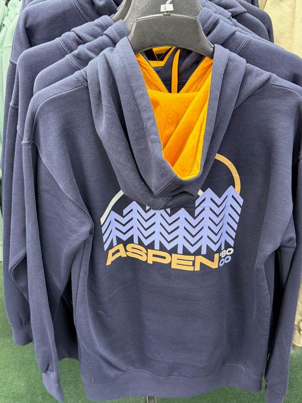 A navy Aspen hoodie with a mountain and sunset design
